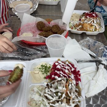 Falafel Cafe - Mix of gyro and chicken shawarma plate in the foreground, plus an order of falafel and two chicken shawarma plates in the background - Falafel Near Me - Birmingham, Alabama Falafel Cafe - Mix of gyro and chicken shawarma plate in the foreground, plus an order of falafel and two chicken shawarma plates in the background - Falafel Near Me - Birmingham, Alabama