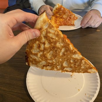 Varsity Pizza - Some (who shall remain nameless) refer to this as the "undercarriage". Lil thick, but light and crispy. - Pizza Near Me - Syracuse, New York
