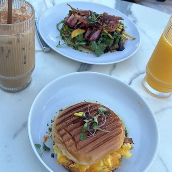 YES PLEASE - Food : Breakfast sandwich on a brioche bun and avocado toast Drinks : iced horchata latte and organic orange juice - Coffee & Tea Near Me - La Quinta, California YES PLEASE - Food : Breakfast sandwich on a brioche bun and avocado toast Drinks : iced horchata latte and organic orange juice - Coffee & Tea Near Me - La Quinta, California