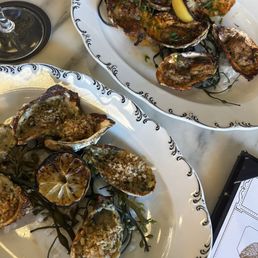 Grilled Oysters (top right) Oyster Rockefeller (bottom left) Grilled Oysters (top right) Oyster Rockefeller (bottom left)