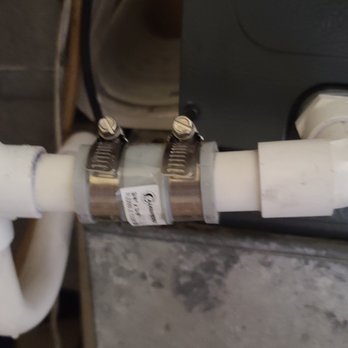 A-C Air Care - They are saying this is the same PVC piping we had in the previous picture.  The clog was located here. - Heating & Air Conditioning/HVAC Near Me