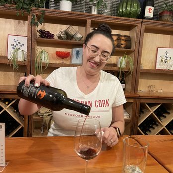 The Urban Cork - a woman pouring a glass of wine - Wine Tasting Room Near Me - Medford, Oregon The Urban Cork - a woman pouring a glass of wine - Wine Tasting Room Near Me - Medford, Oregon