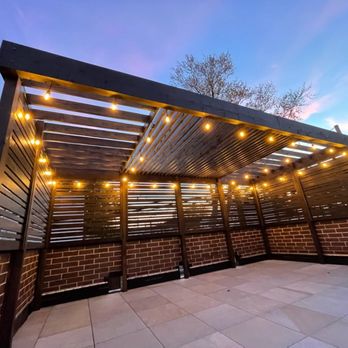 606 Outdoor Design - Another view of the pergola and tile floor. Photo doesn't do it justice, looks even better in real life. - Landscaping Near Me