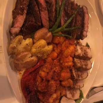 Mama Catena Vino e’ Cucina - This was the "Piatto Orbo" or Blind Plate dinner for 4. The pork & gnocchi were incredible! - Pizza Near Me - Euclid, Ohio