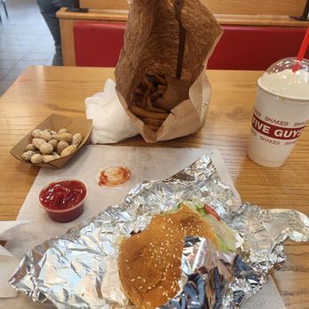 Five Guys - Small burger,  small fries, peanuts and a banana shake!  Yum! Food was good, service good. Very happy! - Burgers Near Me - Woodbridge, Virginia