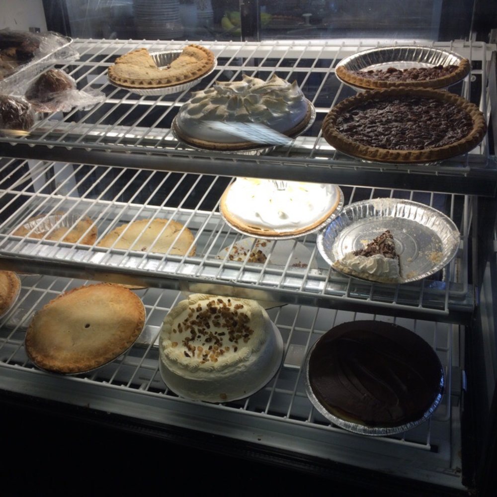 Curly's Chicken House - The pie display. It's not as dark as it looks in the photo. - Chicken Wings Near Me - Elmira, New York Curly's Chicken House - The pie display. It's not as dark as it looks in the photo. - Chicken Wings Near Me - Elmira, New York