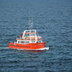 Cape Spear Lighthouse National Historic Site - Visiting tour boat.