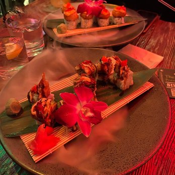Fabrika - a plate of sushi on a wooden table - Seafood Near Me - Jackson Heights, New York Fabrika - a plate of sushi on a wooden table - Seafood Near Me - Jackson Heights, New York