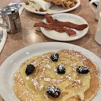 Nancy's Cafe - Lemon curd Pancake (special) with side of bacon; Hillbilly Benedict. 1/2023 - Breakfast & Brunch Near Me - Auburn, California Nancy's Cafe - Lemon curd Pancake (special) with side of bacon; Hillbilly Benedict. 1/2023 - Breakfast & Brunch Near Me - Auburn, California