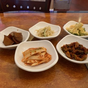 Kalbi Asian Bistro - Banchan: clockwise from top left, soy braised potatoes, bean sprouts, broccoli in mayo, spicy fish, and Kim chi. - Korean Near Me - Wilmington, Delaware Kalbi Asian Bistro - Banchan: clockwise from top left, soy braised potatoes, bean sprouts, broccoli in mayo, spicy fish, and Kim chi. - Korean Near Me - Wilmington, Delaware