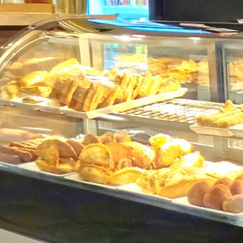 Sophie's Cafe - Closeup of fresh Cuban pastries! You can see yummy Empanadas on the bottom! - Cafes Near Me - Avon Park, Florida Sophie's Cafe - Closeup of fresh Cuban pastries! You can see yummy Empanadas on the bottom! - Cafes Near Me - Avon Park, Florida