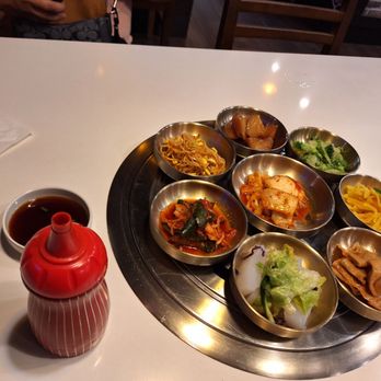 Korea Garden - 8 of 10 Banchan(side dishes). cabbage, fish cake, kimchee cucumber, wonbok kimchee, shoyu potato, bean sprout Kong namul. - Korean Near Me - Honolulu, Hawaii Korea Garden - 8 of 10 Banchan(side dishes). cabbage, fish cake, kimchee cucumber, wonbok kimchee, shoyu potato, bean sprout Kong namul. - Korean Near Me - Honolulu, Hawaii