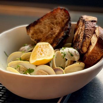 The Greenwich - Roasted little neck clams. Photo by Oanh McClure. - Cocktail Bars Near Me - Denver, Colorado The Greenwich - Roasted little neck clams. Photo by Oanh McClure. - Cocktail Bars Near Me - Denver, Colorado