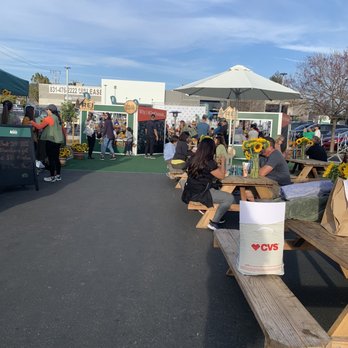 Mattia Pizza - a group of people sitting at picnic tables - Food Trucks Near Me