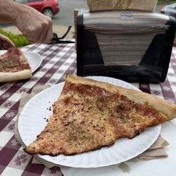 Rocco's Pizzeria - Cheese slice and pepperoni slice. Dressed up with oregano and chili flakes.
