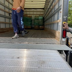 Young Budz Moving - Board of ed pallets being loaded for transport