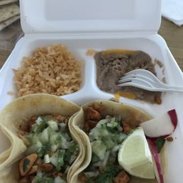 Two tacos- chicken with beans and rice. Heaven Two tacos- chicken with beans and rice. Heaven