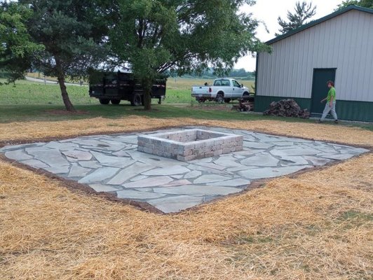 Flagstone Patio and Fire Pit - This beautiful addition was done just down from the house and off the barn where plenty of outdoor seating and gathering can take place. Flagstone Patio and Fire Pit - This beautiful addition was done just down from the house and off the barn where plenty of outdoor seating and gathering can take place.