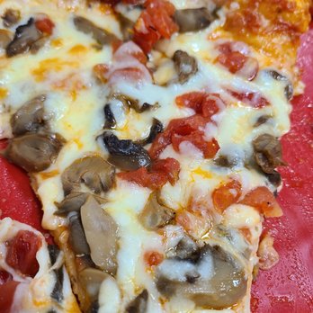 Parrish Pizzeria - a slice of pizza on a red plate - Pizza Near Me - Parrish, Florida