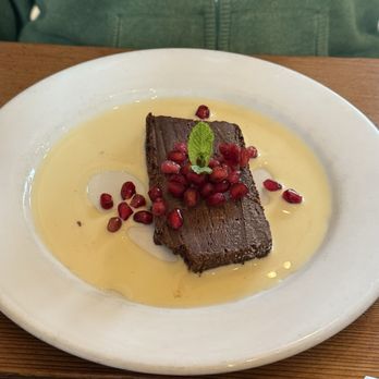 The Leaning Pear - Chocolate terrine with crème anglaise. Pomegranate garnish. - Sandwiches Near Me - Wimberley, Texas The Leaning Pear - Chocolate terrine with crème anglaise. Pomegranate garnish. - Sandwiches Near Me - Wimberley, Texas