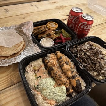 Duzan - a table with a variety of food items - Middle Eastern Near Me - Queens, New York