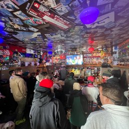 a large group of people at a bar a large group of people at a bar