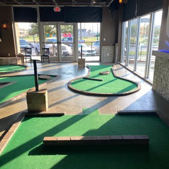 Putters - a miniature golf course in a building - Mini Golf Near Me - Waco, Texas