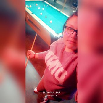 Elkhorn Bar - a woman with glasses and a pool table - Dive Bars Near Me - San Miguel, California Elkhorn Bar - a woman with glasses and a pool table - Dive Bars Near Me - San Miguel, California