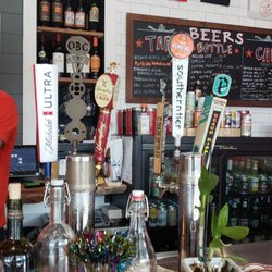 Pumphouse BBQ - Bartender Mason and beer tap selection.