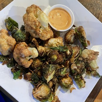 Johnny's Tavern - Brussels & Cauliflower with firecracker sauce - Sports Bars Near Me - Kansas City, Missouri Johnny's Tavern - Brussels & Cauliflower with firecracker sauce - Sports Bars Near Me - Kansas City, Missouri