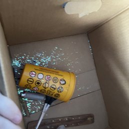 They dumped a bowl of craft glitter into a box glitter bombing us in our new home