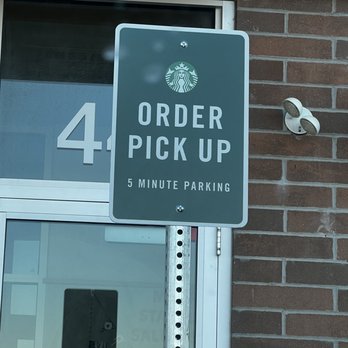 Starbucks - a starbucks order pick up sign in front of a brick building - Coffee & Tea Near Me - Morris, Illinois