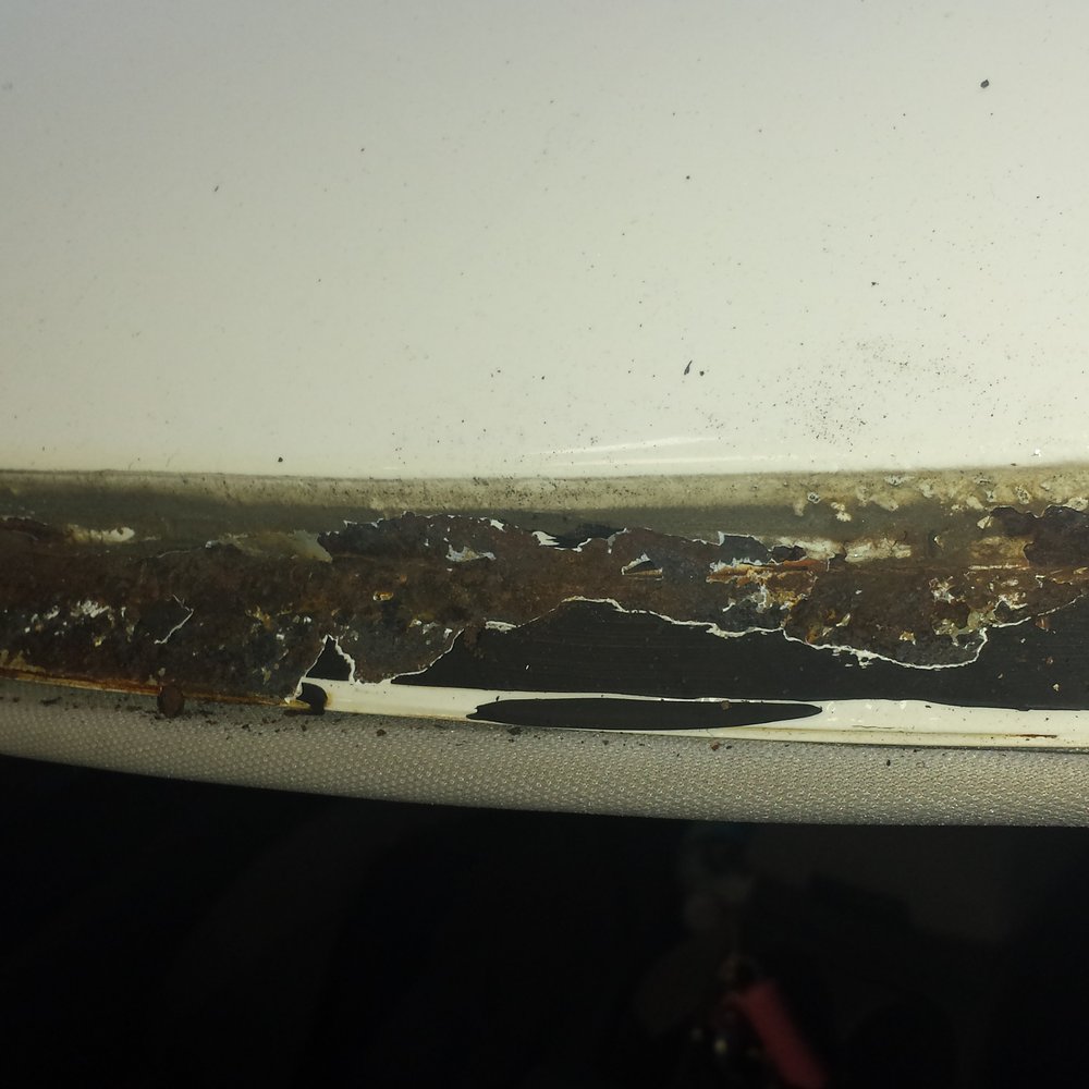 The rust caused by Excellent Auto Glass not installing my windshield properly.