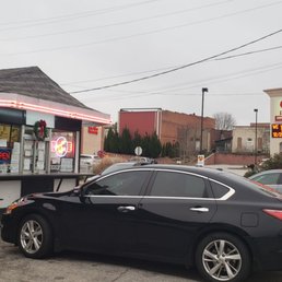a car parked in front of a restaurant