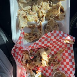 Chile Pequin Mexican Cuisine - Whats supposed to be a beef fajita quesadilla.. more like a cheese quesadilla.. but damn.. $11 and all i got was cheese quesadillas..