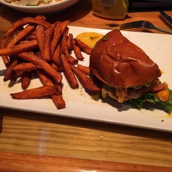 Miller's Ale House - Grilled chicken breast sandwich with sweet potato fries. I already ate half - Sports Bars Near Me - Norridge, Illinois