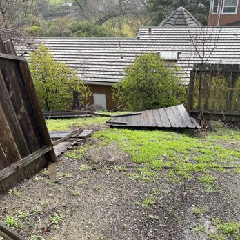 Erick’s Landscaping - Old fence that fell due to the storm - Landscaping Near Me