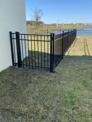 150’ Aluminum Fence & Gate- Osceola County - This Osceola County homeowner trusted our team to install a Residential grade Aluminum fence, and we were able to install in just one-day. The customer’s intent was to allow their dogs access to the backyard without fear of Fido leaving the property. 150’ Aluminum Fence & Gate- Osceola County - This Osceola County homeowner trusted our team to install a Residential grade Aluminum fence, and we were able to install in just one-day. The customer’s intent was to allow their dogs access to the backyard without fear of Fido leaving the property.