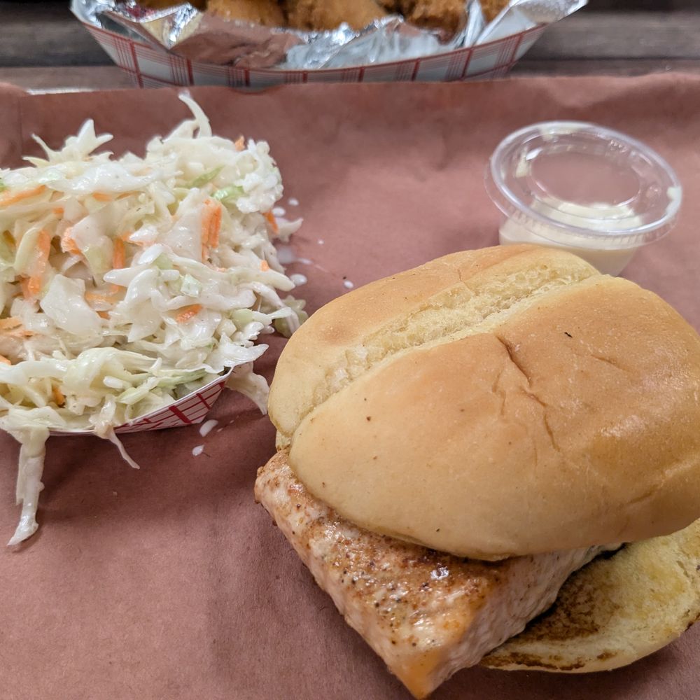 Salmon sandwich with coleslaw. Salmon sandwich with coleslaw.