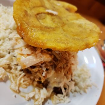 Q'Kenan Restaurant - Plantain sandwich - patacon (green plantain) on top, madurito (sweet plantain) at the bottom - Venezuelan Near Me - Orlando, Florida Q'Kenan Restaurant - Plantain sandwich - patacon (green plantain) on top, madurito (sweet plantain) at the bottom - Venezuelan Near Me - Orlando, Florida