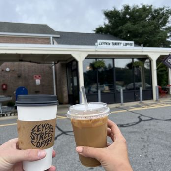 Leyden Street Coffee - Left: oat milk latte; Right: iced harvest latte w/ oat - Coffee & Tea Near Me - Plymouth, Massachusetts Leyden Street Coffee - Left: oat milk latte; Right: iced harvest latte w/ oat - Coffee & Tea Near Me - Plymouth, Massachusetts