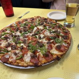 Large sausage, pepperoni, green pepper, and onion pizza.