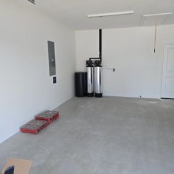 Legacy Flow Plumbing - Water Softener and refiner installed in a customers garage