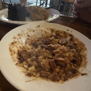 KnuckleHeads - Hubby started before I could snap a pic of it. Red beans and sausage. - American Near Me - Ocean Springs, Mississippi