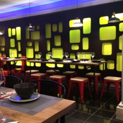 Spice I Am - high tables and backlit wall