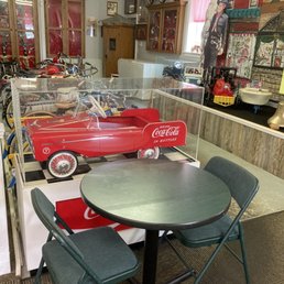 Back seating area with interesting nostalgic items.