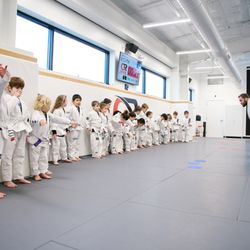 Kids BJJ class at Gracie Raleigh. Ages 4-15, grouped by age and size, multiple coaches per class.