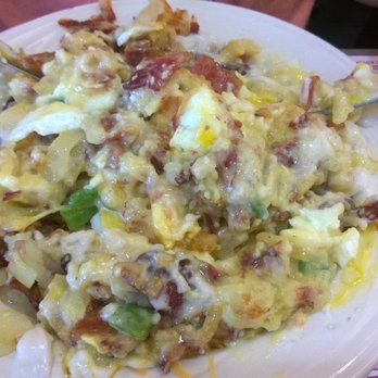 Maple Pancake House - Eggs easy over on biscuits' and gravy. - Breakfast & Brunch Near Me - Sterling, Illinois