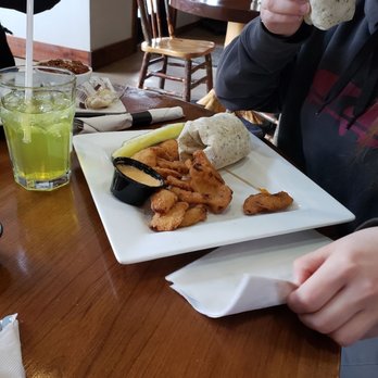 JDs Brew Pub - a person eating a burrito - Pubs Near Me - Springville, New York