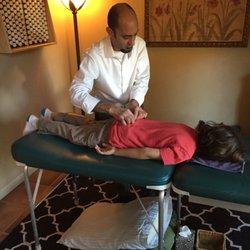The Well Being Center - Dr. Omri applying a gentle adjustment